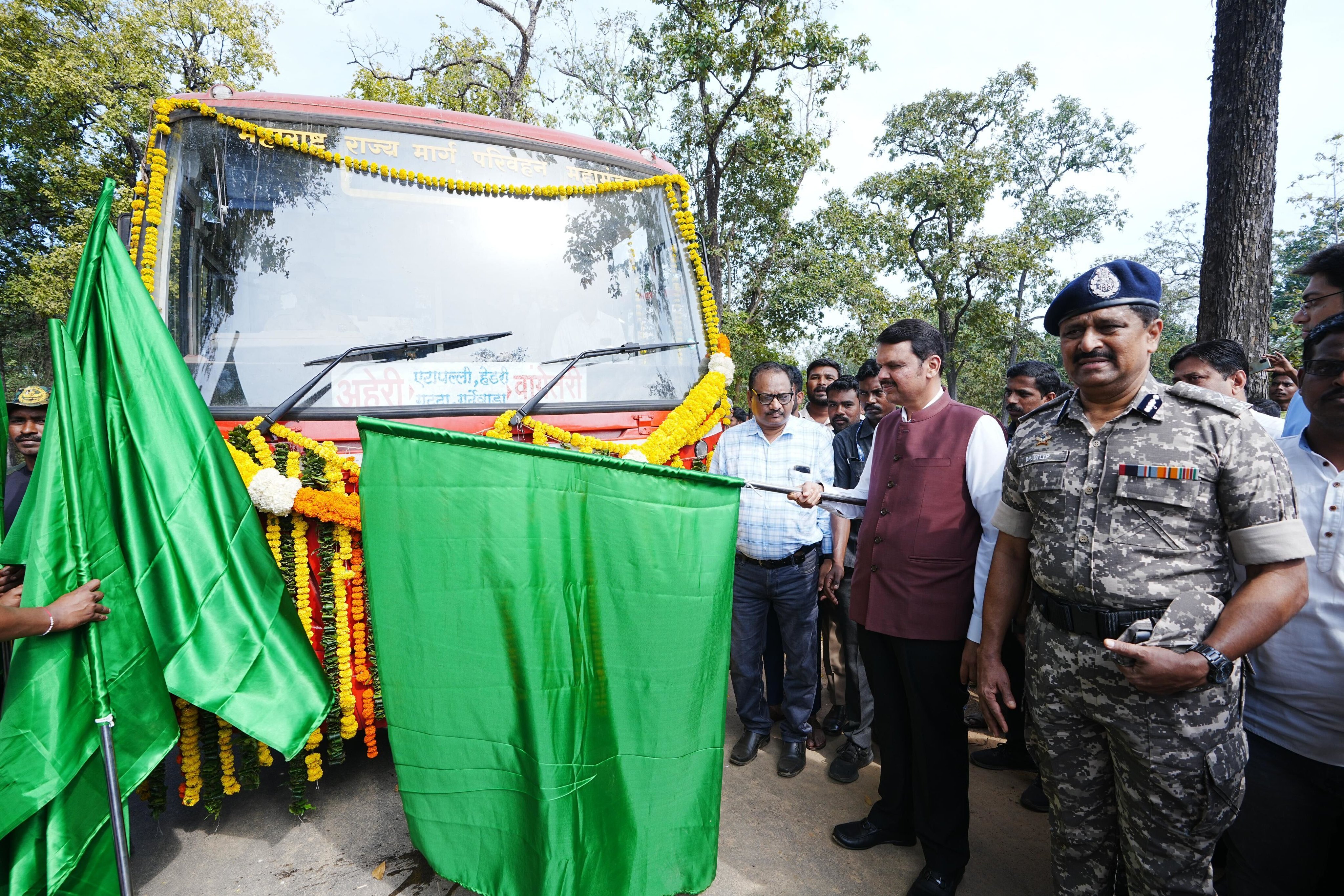 People unveiling a vehicle